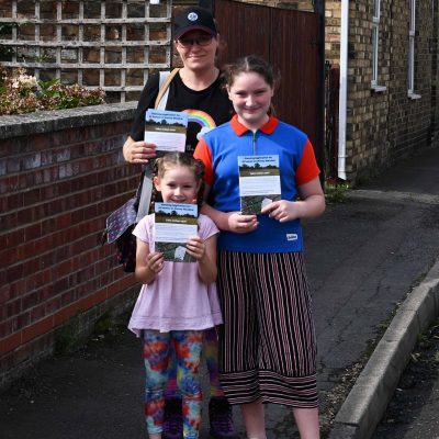 Girl Guides delivering Save Wenny Road Meadow leaflets - Photograph by Rob Morris