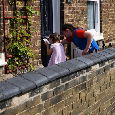 Girl Guides delivering Save Wenny Road Meadow leaflets - Photograph by Rob Morris